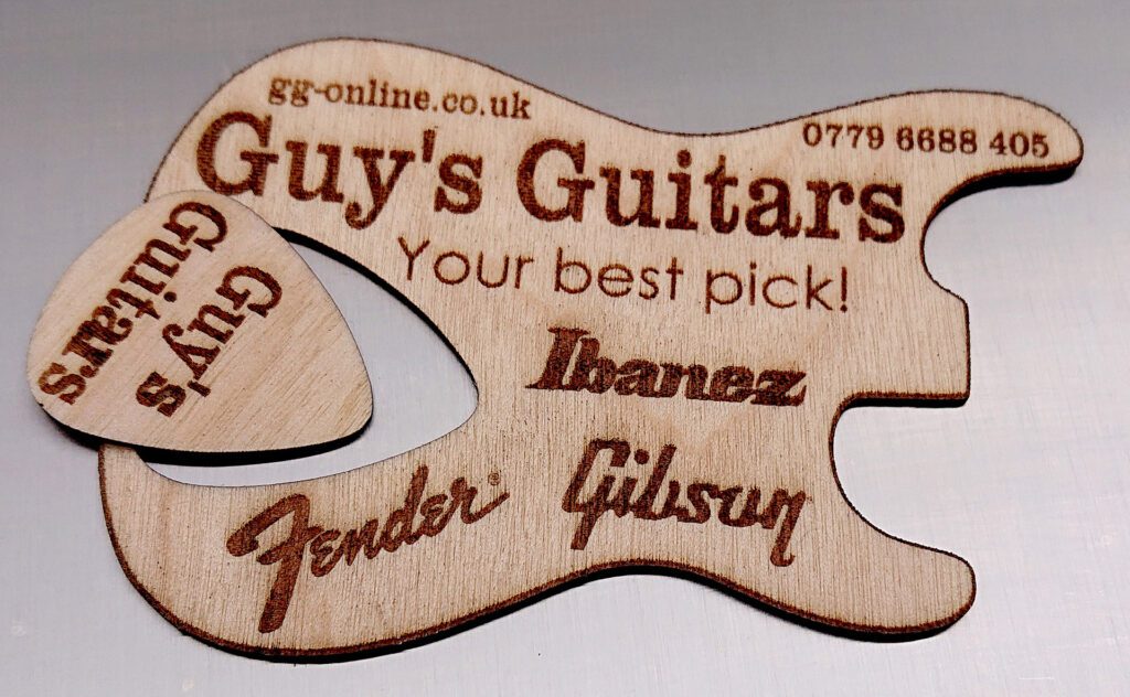 Wooden business card with removable guitar pick