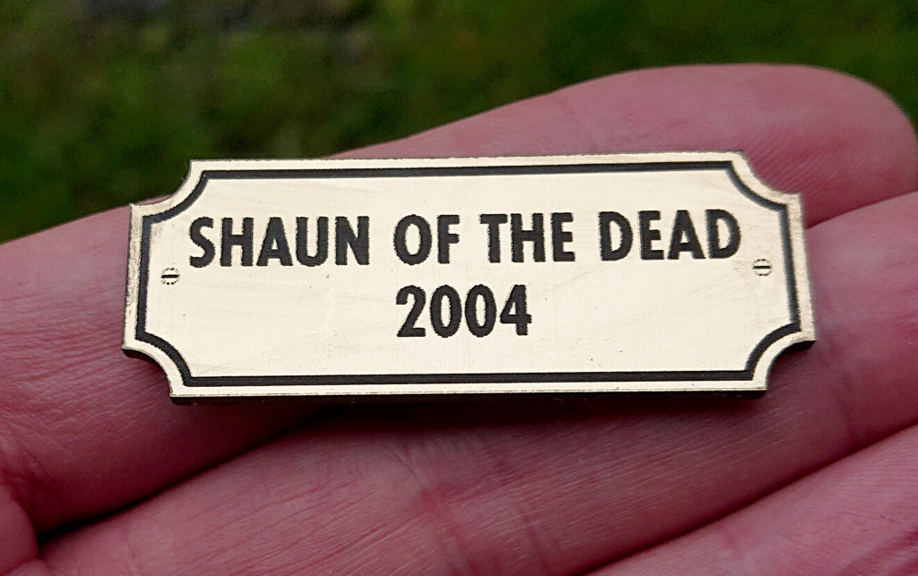 Acrylic laminate badge or trophy plaque